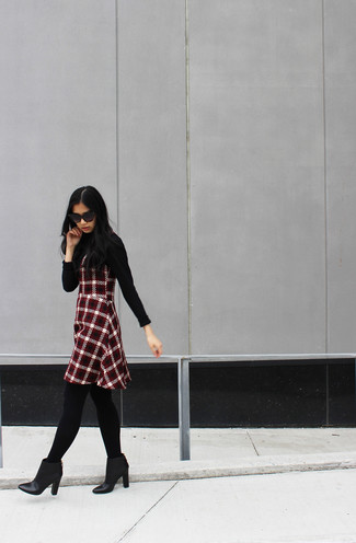 Women's Black Turtleneck, Red and Black Plaid Fit and Flare Dress, Black Leather Ankle Boots, Black Sunglasses