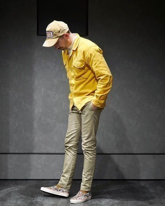 Mustard Long Sleeve Shirt Outfits For Men: This pairing of a mustard long sleeve shirt and olive chinos is super easy to copy and so comfortable to work from dawn till dusk as well! Multi colored print canvas slip-on sneakers are a smart idea to finish this ensemble.