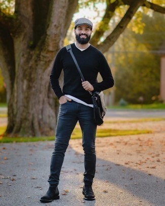 Black Suede Chelsea Boots Outfits For Men: A navy v-neck sweater and navy jeans have become a go-to combination for many fashion-savvy gents. Black suede chelsea boots are a fail-safe way to inject an element of class into this outfit.