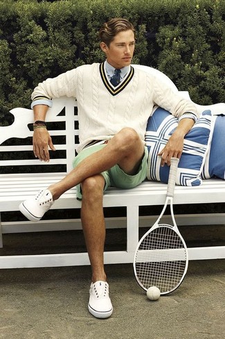 V-neck Sweater Outfits For Men: This relaxed combination of a v-neck sweater and mint shorts is a life saver when you need to look nice in a flash. If in doubt about what to wear when it comes to shoes, go with white canvas low top sneakers.