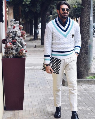 Black Leather Zip Pouch Outfits For Men: If you're on a mission for a street style but also sharp ensemble, go for a white chevron v-neck sweater and a black leather zip pouch. Got bored with this look? Introduce a pair of black leather derby shoes to jazz things up.