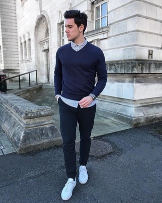 White Vertical Striped Long Sleeve Shirt Outfits For Men: Pairing a white vertical striped long sleeve shirt with navy chinos is a nice idea for a laid-back look. A pair of white canvas low top sneakers will pull your full getup together.