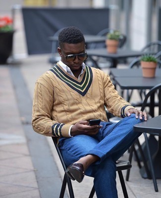 Orange Sunglasses Outfits For Men: This casual and cool look is so simple: a tan v-neck sweater and orange sunglasses. Parade your refined side by finishing off with dark brown leather double monks.