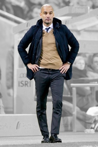 Pep Guardiola wearing White Dress Shirt, Tan V-neck Sweater, Charcoal Vertical Striped Suit, Navy Parka