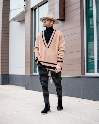 Black Vertical Striped Chinos Outfits: Pair a tan v-neck sweater with black vertical striped chinos for both seriously stylish and easy-to-achieve look. Round off this outfit with black suede chelsea boots to serve a little mix-and-match magic.