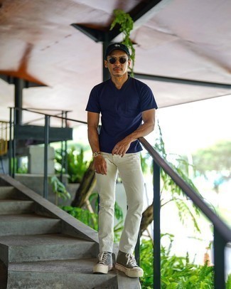 Navy V-neck T-shirt Outfits For Men: For a casually dapper outfit, consider wearing a navy v-neck t-shirt and white jeans — these two pieces go really nice together. Why not add olive canvas high top sneakers to your ensemble for a more relaxed twist?