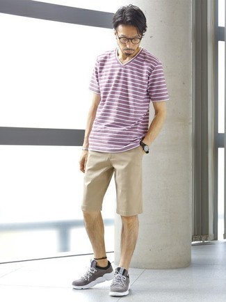 Beige Shorts Outfits For Men: Extremely dapper, this combo of a purple horizontal striped v-neck t-shirt and beige shorts provides with variety. To give your overall ensemble a more laid-back feel, add a pair of grey athletic shoes to the equation.