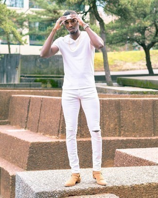 White Ripped Skinny Jeans Outfits For Men: For an off-duty menswear style with a twist, team a white v-neck t-shirt with white ripped skinny jeans. Complete this ensemble with a pair of tan suede chelsea boots to easily amp up the classy factor of any ensemble.