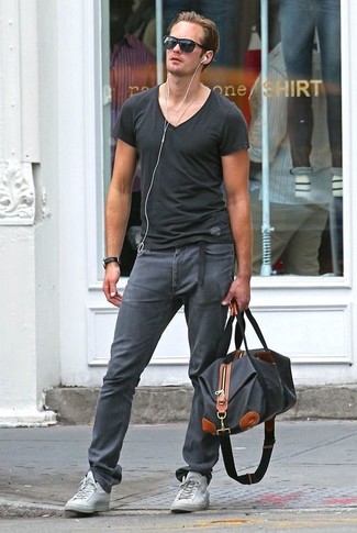 Men's Black V-neck T-shirt, Charcoal Skinny Jeans, Grey Low Top Sneakers, Black Leather Duffle Bag