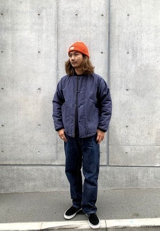 Orange Beanie Outfits For Men: Rushed mornings require a pared down yet casually cool ensemble, such as a navy varsity jacket and an orange beanie. Breathe a dash of refinement into this outfit by slipping into a pair of black canvas slip-on sneakers.