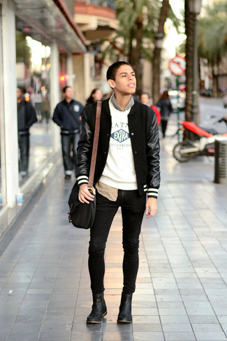 Black and White Varsity Jacket Outfits For Men: For a casual outfit with a contemporary spin, pair a black and white varsity jacket with black skinny jeans. For a dressier aesthetic, introduce black leather chelsea boots to this outfit.