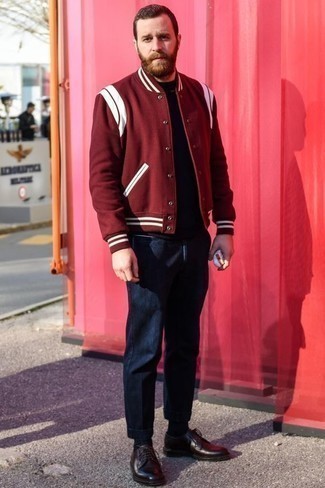 Red Varsity Jacket Outfits For Men: The combination of a red varsity jacket and navy chinos makes for a solid casual outfit. Rounding off with dark brown leather derby shoes is an easy way to add some extra classiness to this getup.