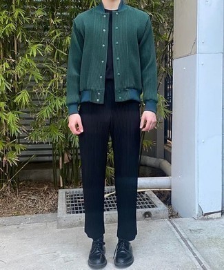 Dark Green Varsity Jacket Outfits For Men: Make a dark green varsity jacket and navy chinos your outfit choice for a laid-back ensemble with a fashionable spin. To introduce some extra definition to this look, introduce black leather derby shoes to this outfit.