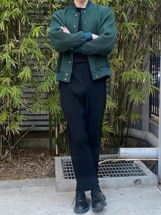 Dark Green Varsity Jacket Outfits For Men: Rock a dark green varsity jacket with navy vertical striped chinos for a laid-back and trendy outfit. Go ahead and complement your ensemble with a pair of black leather derby shoes for an extra dose of elegance.