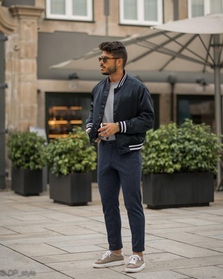 Brown Suede Low Top Sneakers Outfits For Men: A black varsity jacket and charcoal wool chinos teamed together are the ideal ensemble for those dressers who appreciate off-duty getups. Consider brown suede low top sneakers as the glue that will bring this getup together.
