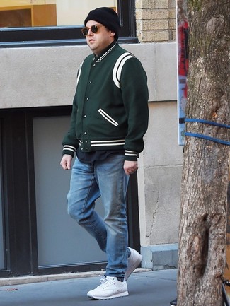 Olive Varsity Jacket Outfits For Men: This ensemble with an olive varsity jacket and light blue jeans isn't super hard to score and is open to more creative experimentation. Rounding off with white athletic shoes is a surefire way to infuse a more casual finish into your ensemble.