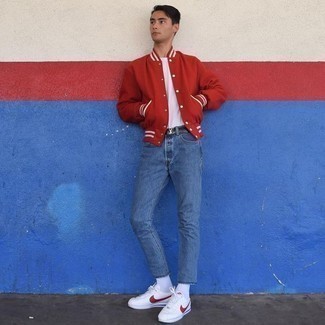Red and White Varsity Jacket Outfits For Men: This laid-back combo of a red and white varsity jacket and blue jeans is a safe bet when you need to look great but have no extra time. Introduce a pair of white and red athletic shoes to the equation to bring a touch of stylish casualness to your look.