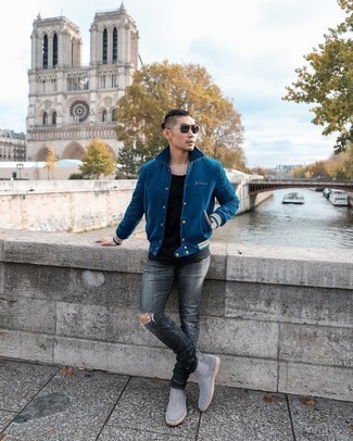 Charcoal Ripped Jeans Outfits For Men: Try teaming a navy varsity jacket with charcoal ripped jeans to put together an extra stylish and urban ensemble. Tone down the casualness of this outfit by sporting a pair of grey suede chelsea boots.