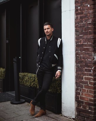 Black and White Varsity Jacket Outfits For Men: If you're in search of a relaxed and at the same time seriously stylish ensemble, wear a black and white varsity jacket with black skinny jeans. Here's how to dress it up: brown suede chelsea boots.