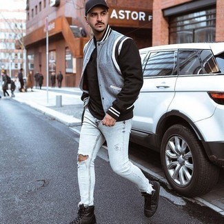 Black Leather High Top Sneakers Outfits For Men: This street style combo of a light blue varsity jacket and light blue ripped skinny jeans can only be described as devastatingly stylish. Add black leather high top sneakers to your ensemble for an instant style upgrade.