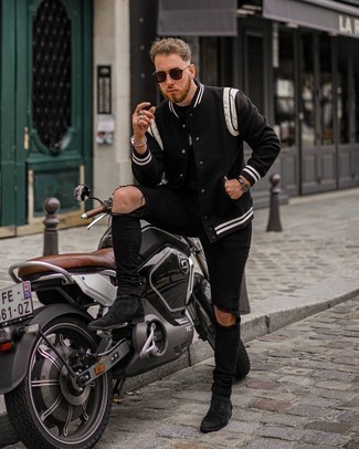 Black and White Varsity Jacket Outfits For Men: A black and white varsity jacket and black ripped skinny jeans are a savvy combination to keep in your daily casual fashion mix. For a classier take, go for black suede chelsea boots.