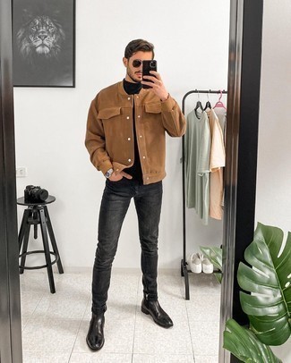Tan Varsity Jacket Outfits For Men: For practicality without the need to sacrifice on style, we love this pairing of a tan varsity jacket and charcoal skinny jeans. Inject a touch of class into your ensemble by finishing off with a pair of black leather chelsea boots.