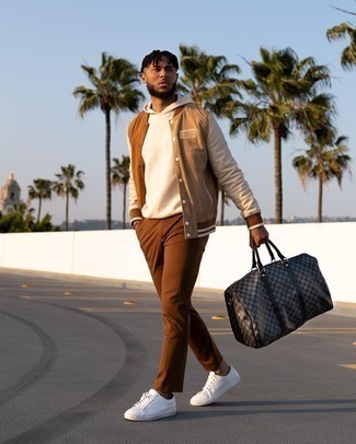 Brown Varsity Jacket Outfits For Men: Team a brown varsity jacket with brown chinos to feel instantly confident in yourself and look laid-back and cool. If in doubt about what to wear in the shoe department, go with white canvas low top sneakers.