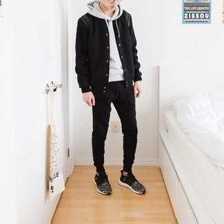 Black Varsity Jacket Outfits For Men: This combo of a black varsity jacket and black sweatpants is undeniable proof that a safe casual look can still be really interesting. Our favorite of a multitude of ways to finish off this look is charcoal athletic shoes.