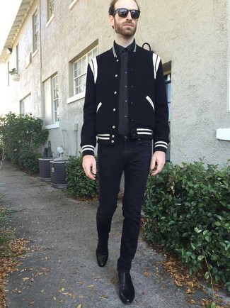 Black Varsity Jacket Outfits For Men: Consider teaming a black varsity jacket with black jeans to assemble a day-to-day look that's full of charm and character. Black leather chelsea boots will breathe a sense of sophistication into an otherwise mostly casual look.