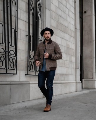 Men's Brown Varsity Jacket, Blue Chambray Long Sleeve Shirt, Navy Jeans, Brown Leather Casual Boots