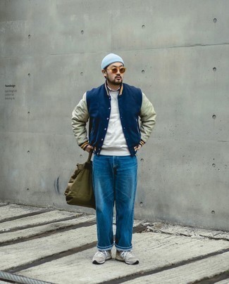 Light Blue Beanie Outfits For Men: Consider pairing a navy varsity jacket with a light blue beanie for a stylish and easy-going look. Put a more sophisticated spin on your ensemble by wearing grey athletic shoes.