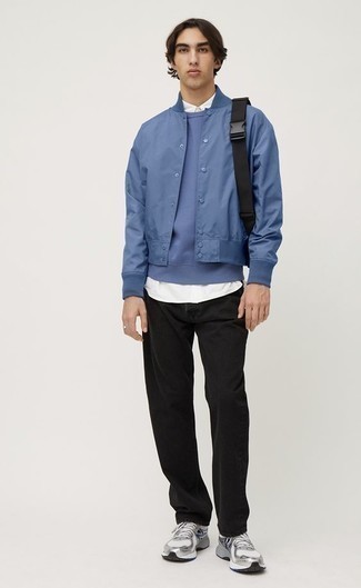 Black Canvas Backpack Outfits For Men: For an ensemble that provides comfort and dapperness, marry a blue varsity jacket with a black canvas backpack. Feeling transgressive? Smarten up this ensemble by finishing with silver athletic shoes.
