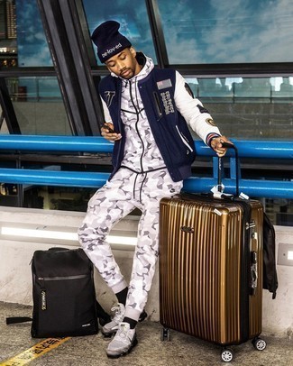 Navy Print Varsity Jacket Outfits For Men: Pair a navy print varsity jacket with a grey track suit for an urban outfit that's also easy to pull together. The whole ensemble comes together if you introduce grey athletic shoes to this outfit.