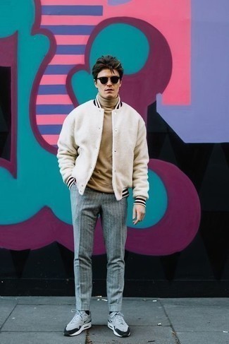 Charcoal Vertical Striped Chinos Outfits: If you wish take your casual look to a new height, try pairing a white varsity jacket with charcoal vertical striped chinos. Ramp up the style factor of your outfit by sporting a pair of grey athletic shoes.