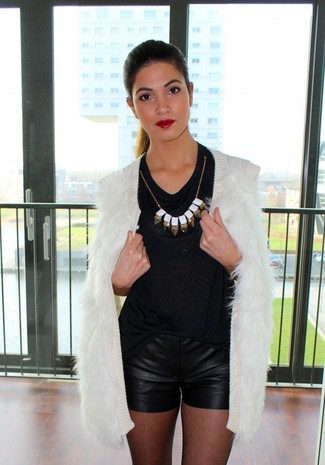 Black Leather Shorts Outfits For Women: Inject style into your current off-duty routine with a white fur vest and black leather shorts.