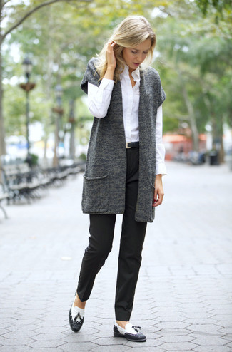 Black and White Leather Tassel Loafers Outfits For Women: This casual combo of a charcoal knit vest and black dress pants is very easy to put together in no time flat, helping you look awesome and ready for anything without spending a ton of time searching through your wardrobe. Black and white leather tassel loafers will bring a sense of class to an otherwise too-common outfit.