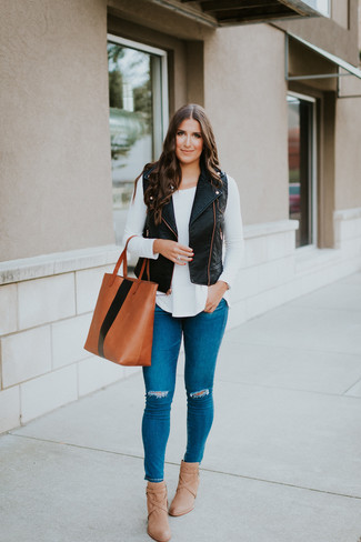 Women's Black Leather Vest, White Long Sleeve T-shirt, Blue Ripped Skinny Jeans, Tan Leather Ankle Boots