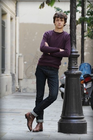 Purple Crew-neck Sweater Outfits For Men: Prove that you know a thing or two about menswear in a purple crew-neck sweater and navy jeans. Finishing with brown leather chelsea boots is a fail-safe way to give an extra touch of refinement to this look.