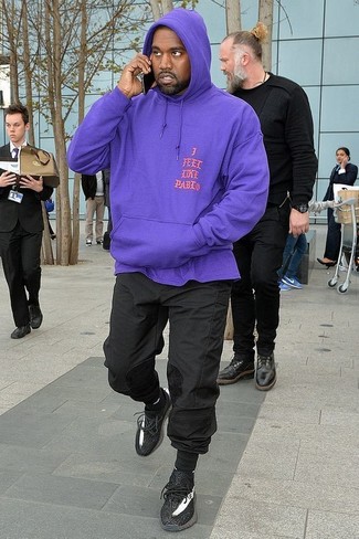 This casual street style combination of a violet hoodie and black sweatpants is super easy to pull together in no time flat, helping you look awesome and prepared for anything without spending a ton of time combing through your wardrobe. Introduce a pair of black athletic shoes to the mix and you're all done and looking awesome.