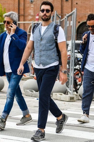 Navy Canvas Backpack Outfits For Men: This combination of a light blue denim waistcoat and a navy canvas backpack is impeccably stylish and yet it's casual and apt for anything. Finishing off with a pair of grey athletic shoes is a surefire way to inject a bit more edginess into your ensemble.