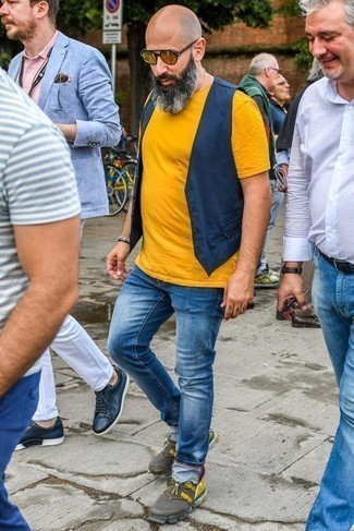 Mustard Crew-neck T-shirt Outfits For Men: This pairing of a mustard crew-neck t-shirt and blue jeans is clean, on-trend and super easy to recreate. Bring a relaxed twist to an otherwise classic outfit by sporting multi colored athletic shoes.