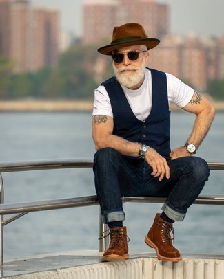 Brown Wool Hat Outfits For Men: No matter where you find yourself over the course of the day, you can rely on this relaxed casual pairing of a navy waistcoat and a brown wool hat. Rounding off with a pair of brown suede casual boots is the simplest way to introduce some extra fanciness to this look.