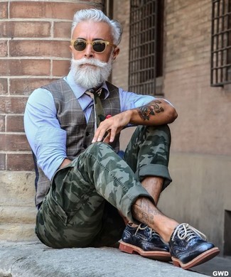 For a casually sleek look, try teaming a grey plaid waistcoat with olive camouflage cargo pants — these items play really well together. Finishing off with a pair of black leather brogues is an easy way to bring a little depth to your look.