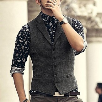 Grey Waistcoat Outfits: A grey waistcoat and dark brown chinos are absolute wardrobe heroes if you're crafting a classic wardrobe that holds to the highest menswear standards.