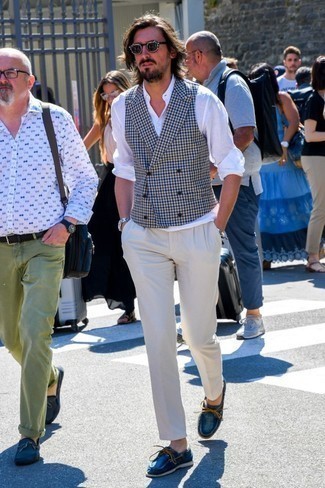 Navy Driving Shoes with Waistcoat Summer Outfits: Try teaming a waistcoat with beige chinos to don a neat and polished ensemble. For a truly modern mix, add navy driving shoes. We can't get enough of this getup for hot hot weather afternoons.
