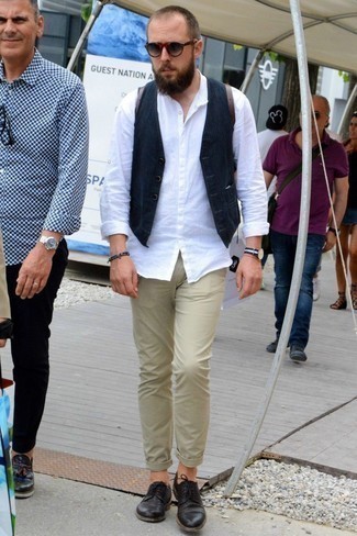 Beige Chinos with Brown Leather Derby Shoes Outfits: A navy waistcoat and beige chinos are absolute wardrobe heroes if you're piecing together a sophisticated wardrobe that matches up to the highest men's fashion standards. Complete this look with brown leather derby shoes and the whole outfit will come together perfectly.