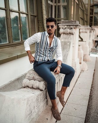 Tan Fringe Suede Loafers Outfits For Men: This pairing of a light blue vertical striped waistcoat and navy chinos is an interesting balance between dressy and off-duty. For a smarter touch, complete your getup with a pair of tan fringe suede loafers.