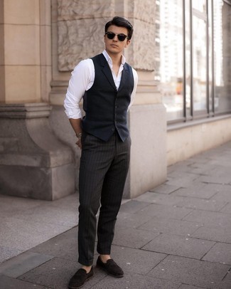 Navy Waistcoat Outfits: You're looking at the definitive proof that a navy waistcoat and black vertical striped chinos look awesome when worn together in a classy ensemble for a modern man. If you need to immediately perk up your getup with a pair of shoes, add a pair of dark brown suede loafers to the mix.