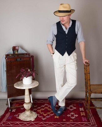 Tan Straw Hat Outfits For Men: If you're a fan of off-duty style, why not take this pairing of a navy waistcoat and a tan straw hat for a spin? Navy embroidered canvas loafers will dress up this look.