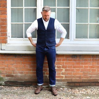 Navy Waistcoat Outfits: Pair a navy waistcoat with navy jeans for masculine refinement with a modern finish. And if you want to easily dress down your outfit with shoes, complete this look with dark brown leather desert boots.